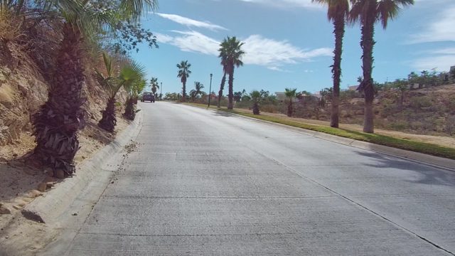 EAST CAPE LOS CABOS BCS MEXICO-2022: Road with Palm Trees and Dry Hills