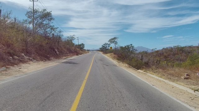 EAST CAPE LOS CABOS BCS MEXICO-2022: Rural Road in Arid Landscape with Sparse Vegetation