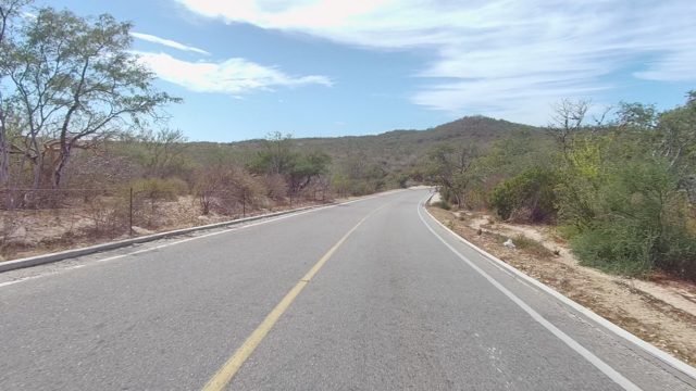 EAST CAPE LOS CABOS BCS MEXICO-2022: Paved Road Winding Through Dry Bushland