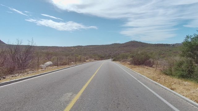 EAST CAPE LOS CABOS BCS MEXICO-2022: Car Approaching on Arid Highway