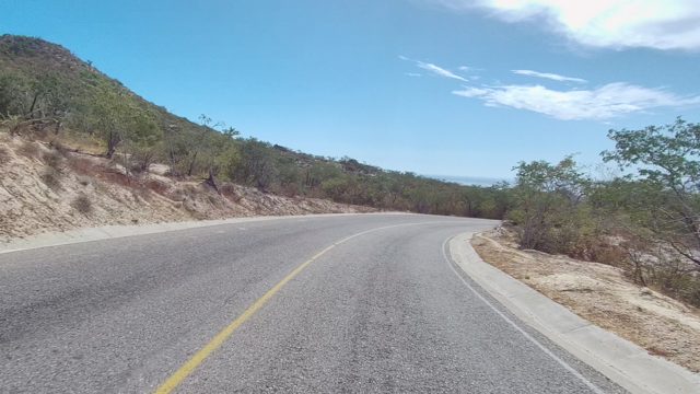 EAST CAPE LOS CABOS BCS MEXICO-2022: Winding Road Through Arid Hillside Landscape