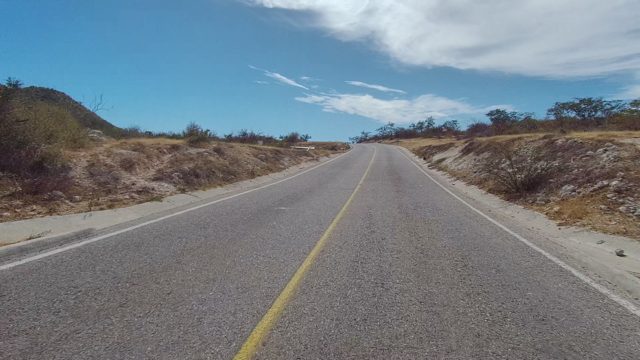 EAST CAPE LOS CABOS BCS MEXICO-2022: Two-Lane Paved Road in Arid Landscape