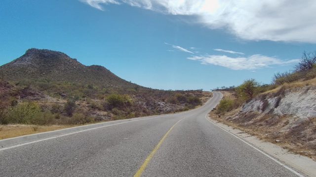 EAST CAPE LOS CABOS BCS MEXICO-2022: Winding Road Through Arid Mountain Landscape