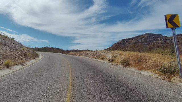 EAST CAPE LOS CABOS BCS MEXICO-2022: Winding Road Through Dry Hills with Oncoming Traffic