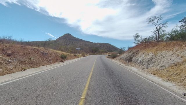 EAST CAPE LOS CABOS BCS MEXICO-2022: Driving on a Two-Lane Road Through Arid Hills
