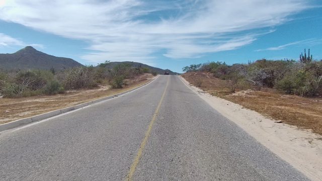 EAST CAPE LOS CABOS BCS MEXICO-2022: Vehicle Approaching and Passing on a Desert Road