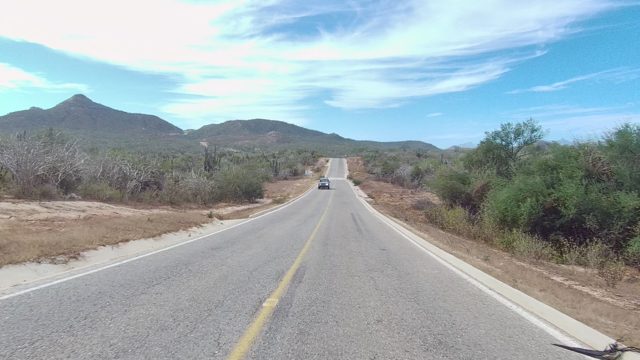 EAST CAPE LOS CABOS BCS MEXICO-2022: Vehicle Passing on Desert Highway