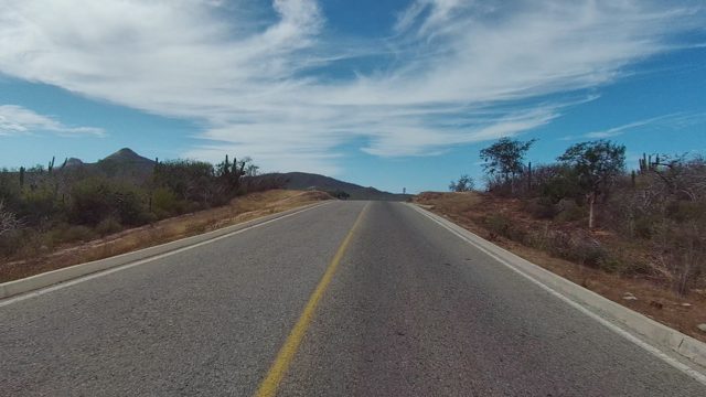 EAST CAPE LOS CABOS BCS MEXICO-2022: Paved Road Through Arid Desert Landscape