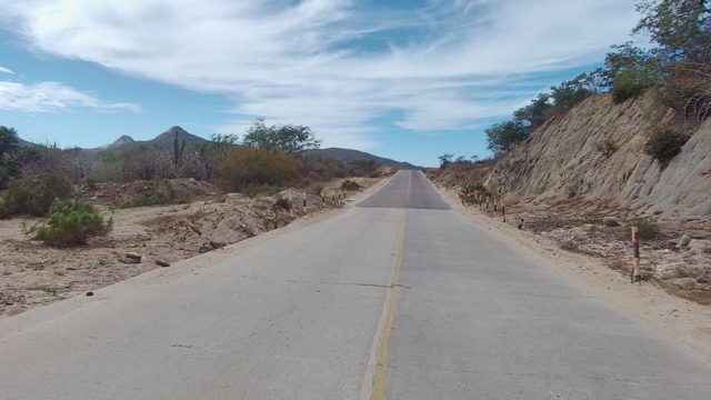EAST CAPE LOS CABOS BCS MEXICO-2022: Paved Road Through Arid Mountain Landscape