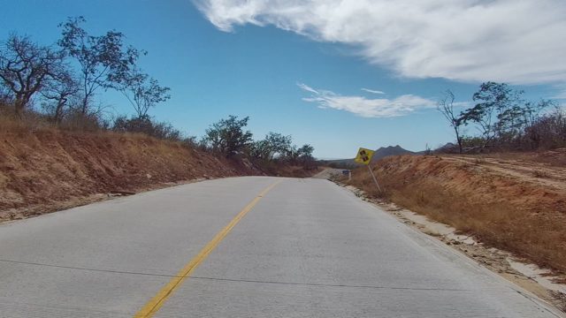EAST CAPE LOS CABOS BCS MEXICO-2022: Car Driving Away on a Winding Rural Road