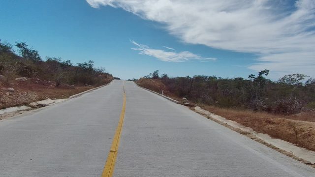 EAST CAPE LOS CABOS BCS MEXICO-2022: Driving Along a Winding Road Through Dry Hilly Terrain