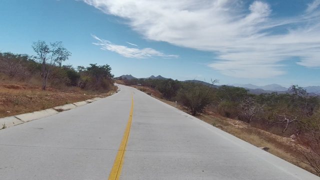 EAST CAPE LOS CABOS BCS MEXICO-2022: Paved Road Through Arid Hillside Landscape