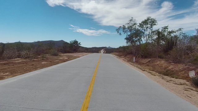 EAST CAPE LOS CABOS BCS MEXICO-2022: Paved Road Through Arid Mountainous Landscape