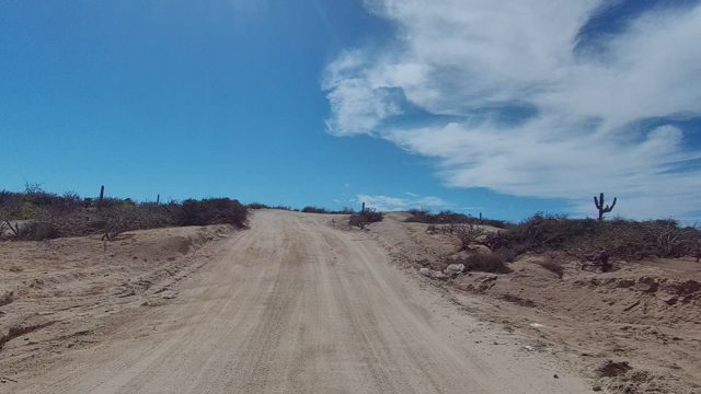 EAST CAPE LOS CABOS BCS MEXICO-2022: Dirt Road Through Arid Desert Terrain