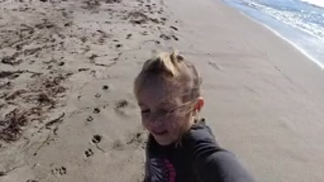 TRESTLES BEACH CALIFORNIA-2019: Happy Baby Girl Walking On The Beach