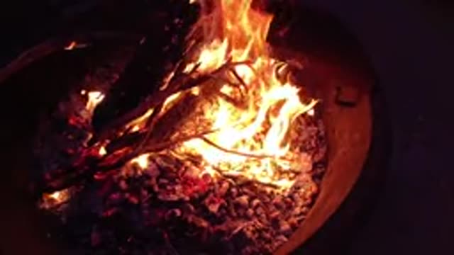 TRESTLES BEACH CALIFORNIA-2019: Medium Size Fire Burning In A Burn Barrel At Night