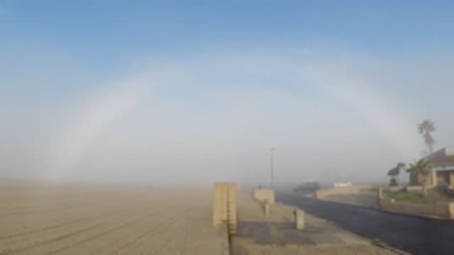 HUNTINGTON BEACH CALIFORNIA-2019: Video Showing A Faintly Appearing Rainbow Over