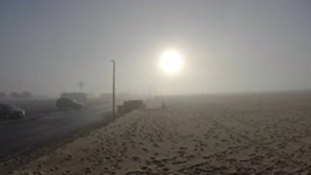 HUNTINGTON BEACH CALIFORNIA-2019: Cars Packed Opposite A Large Sandy Land As The
