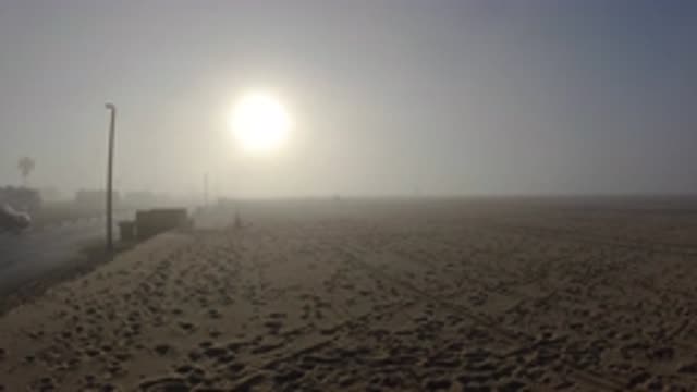 HUNTINGTON BEACH CALIFORNIA-2019: Sun On Sand In Hazy Desert Many Lines In