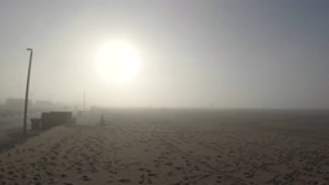 HUNTINGTON BEACH CALIFORNIA-2019: Foggy Landscape Of A Desert By A Road With The