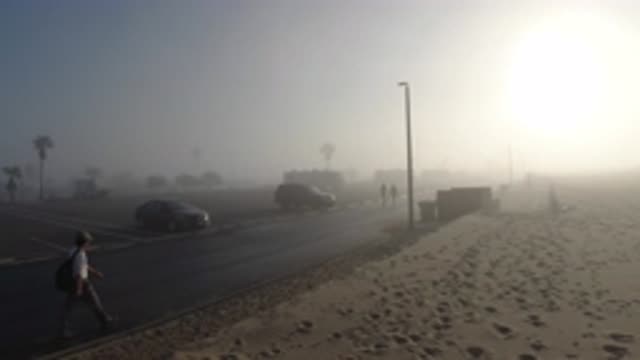 HUNTINGTON BEACH CALIFORNIA-2019: A Beachside Street With People And Cars