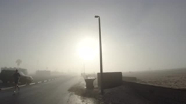 HUNTINGTON BEACH CALIFORNIA-2019: People Walking On The Street Even On A Very Foggy Day