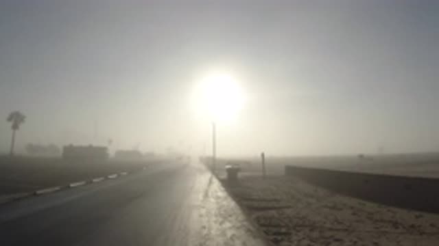 HUNTINGTON BEACH CALIFORNIA-2019: Road In A Dusty Wind With The Sun Shining On