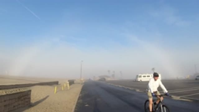 HUNTINGTON BEACH CALIFORNIA-2019: Beautiful Sun Dog Paints A Blue Sky In A