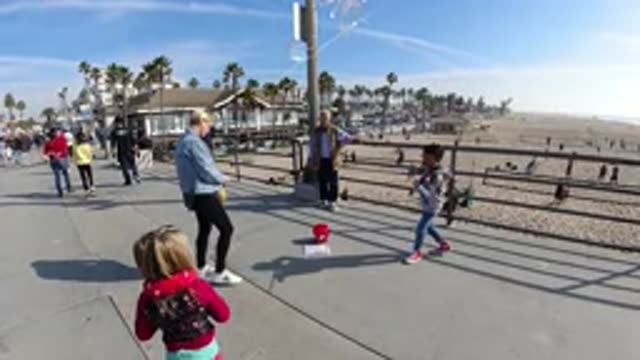 HUNTINGTON BEACH CALIFORNIA-2019: A Slow Motion Group Of People Walking Towards