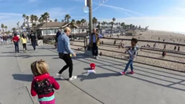 HUNTINGTON BEACH CALIFORNIA-2019: Slow Motion Crowd Right Next To A Beach