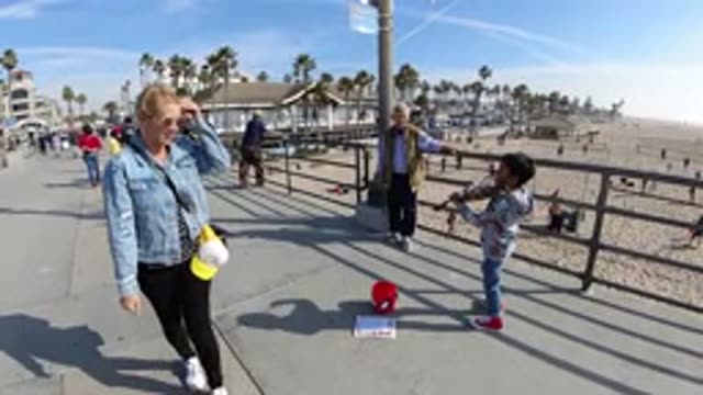 HUNTINGTON BEACH CALIFORNIA-2019: A Slow Motion Picture Of A Kid Playing Violin