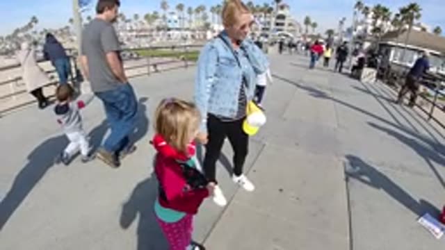 HUNTINGTON BEACH CALIFORNIA-2019: Slow Motion Crowd Of People Standing And Walking