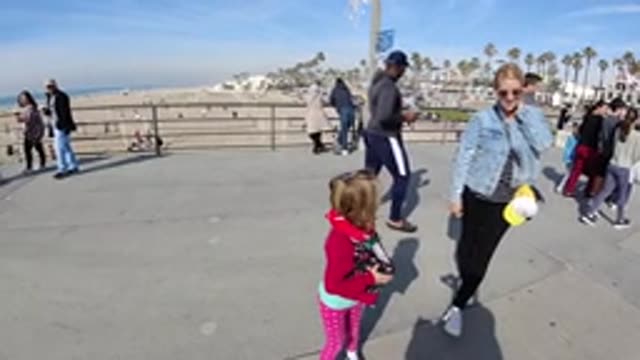 HUNTINGTON BEACH CALIFORNIA-2019: Slow Motion Mother And Daughter On A Park Walk