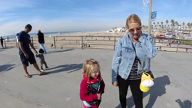 HUNTINGTON BEACH CALIFORNIA-2019: Slow Motion Clip Of A Mother And Daughter