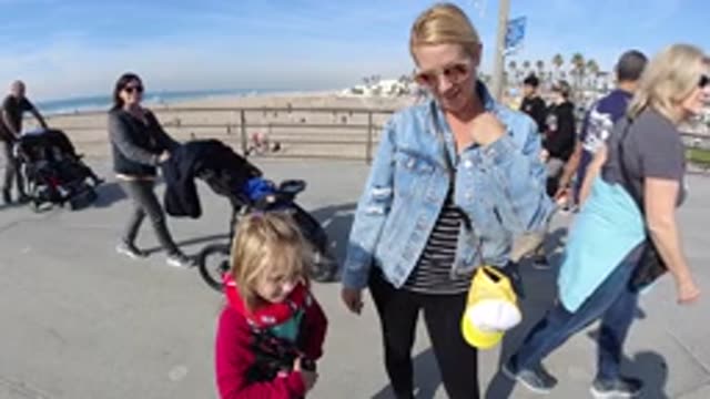 HUNTINGTON BEACH CALIFORNIA-2019: A Slow Motion Picture Of A Family At The Beach