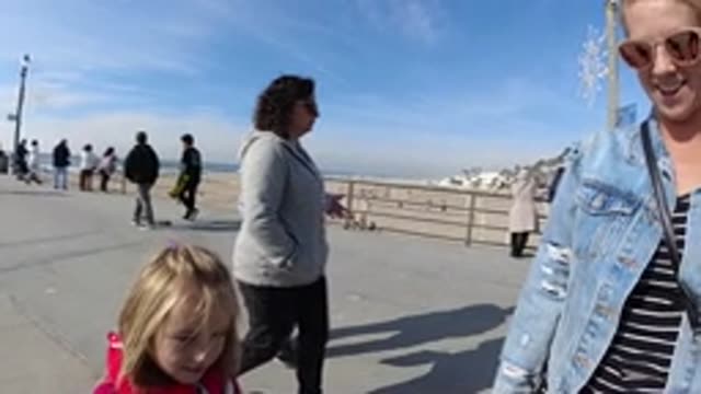 HUNTINGTON BEACH CALIFORNIA-2019: Many People Are Walking Standing And Strolling