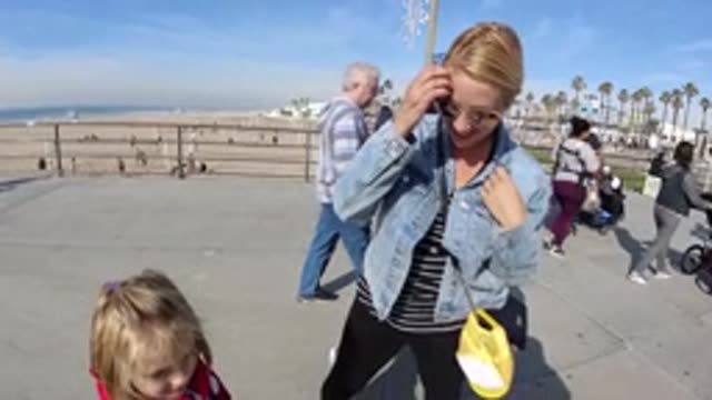 HUNTINGTON BEACH CALIFORNIA-2019: A Mother Looking Admiringly At Her Daughter