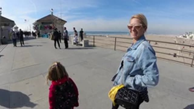HUNTINGTON BEACH CALIFORNIA-2019: Happy Family Enjoying Sunny Day On A Pier Near