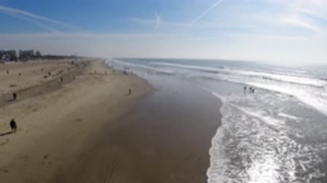HUNTINGTON BEACH CALIFORNIA-2019: Beach Sand Water People Sun Waves Relaxing