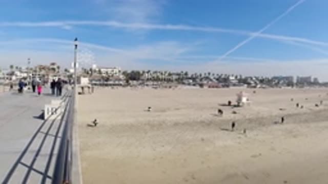 HUNTINGTON BEACH CALIFORNIA-2019: Beautiful Day On The Bright Sunny Boardwalk