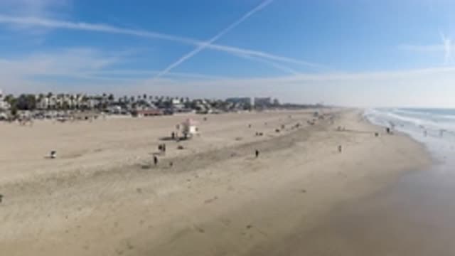 HUNTINGTON BEACH CALIFORNIA-2019: A Lot Of People Are On A Beach On A Sunny And