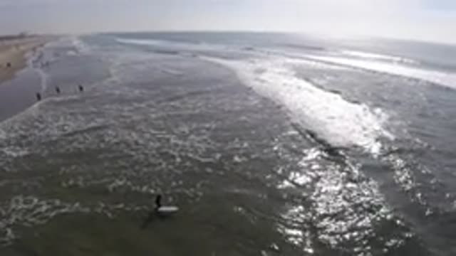 HUNTINGTON BEACH CALIFORNIA-2019: Beachgoers Enjoying An Afternoon At The Sea