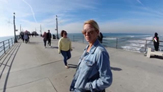 HUNTINGTON BEACH CALIFORNIA-2019: A Slow Motion Picture Of A Woman Enjoying