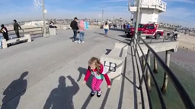 HUNTINGTON BEACH CALIFORNIA-2019: Girl In A Square On The Beach Jumping On The