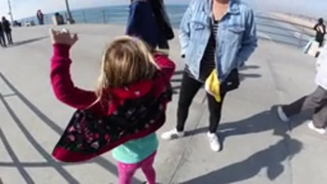 HUNTINGTON BEACH CALIFORNIA-2019: Little Girl Jumping Up And Down In Slow Motion