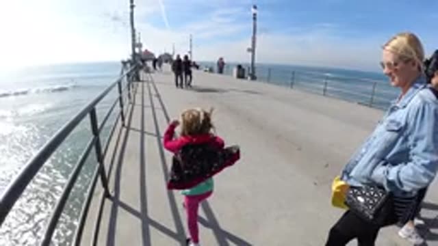 HUNTINGTON BEACH CALIFORNIA-2019: Girl Jumping For Joy At Arriving At The Park