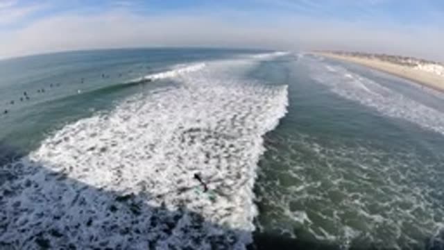 HUNTINGTON BEACH CALIFORNIA-2019: People Swimming in the Ocean Near the Shore