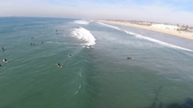 HUNTINGTON BEACH CALIFORNIA-2019: There Is A Greenish Blueish Wave That Is Approaching The Shore
