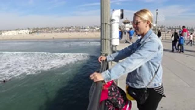 HUNTINGTON BEACH CALIFORNIA-2019: White Woman Wearing Denim Jacket Standing On Pier