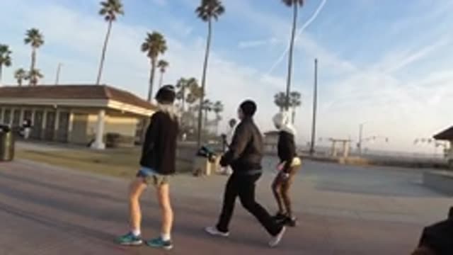 HUNTINGTON BEACH CALIFORNIA-2019: Teen Friends Walking Together